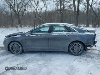 2015 Lincoln MKZ z VIN 3LN6L2J99FR606377, wystawiony jako IAAI lot #41597537 z przebiegiem 110 746 mil mil oraz . Historia ofert i sprzedaży dostępna na DreamBid. Obrazek 14.