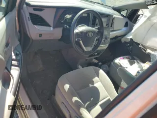 2017 Toyota Sienna L with VIN 5TDZZ3DC4HS779589, listed as a Copart auction lot 48860415 with 128,566 mi miles and Salvage Title. Bid and sale history available at DreamBid. Image 8.