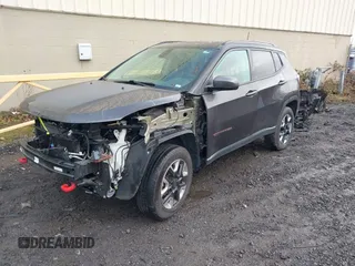 2017 Jeep Compass Trailhawk with VIN 3C4NJDDB9HT657173, listed as a IAAI auction lot 41613348 with 60,781 mi miles and . Bid and sale history available at DreamBid. Image 2.