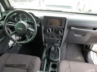 2009 Jeep Wrangler Rubicon with VIN 1J4GA64149L707142, listed as a Copart auction lot 76387344 with Not Provided miles and Salvage Title. Bid and sale history available at DreamBid. Image 8.