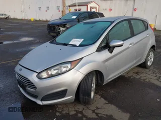 2019 Ford Fiesta SE z VIN 3FADP4EJ7KM147864, wystawiony jako IAAI lot #41692160 z przebiegiem 87 417 mil mil oraz . Historia ofert i sprzedaży dostępna na DreamBid. Obrazek 2.
