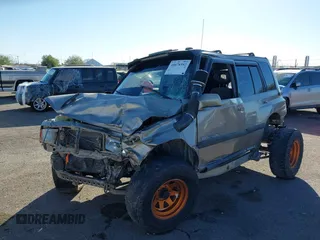 1995 Suzuki Sidekick JX z VIN 2S3TD03V3S6406536, wystawiony jako IAAI lot #40878592 z przebiegiem 253 055 mil mil oraz . Historia ofert i sprzedaży dostępna na DreamBid. Obrazek 2.