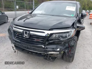 2019 Honda Ridgeline Sport with VIN 5FPYK3F10KB046552, listed as a IAAI auction lot 41983384 with 77,229 mi miles and . Bid and sale history available at DreamBid. Image 6.