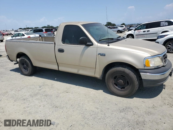 2000 Ford F-150 XL with VIN 1FTZF172XYNB65958, listed as a Copart auction lot 59946145 with 208,988 mi miles and Salvage title. Bid and sale history available at DreamBid. Image 4.