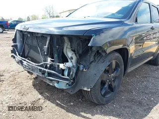 2016 Jeep Grand Cherokee High Altitude z VIN 1C4RJFCGXGC334335, wystawiony jako IAAI lot #42188996 z przebiegiem 212 689 mil mil oraz . Historia ofert i sprzedaży dostępna na DreamBid. Obrazek 6.