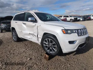 2017 Jeep Grand Cherokee Overland with VIN 1C4RJFCG7HC707767, listed as a Copart auction lot 82345154 with 96,374 mi miles and Salvage Title. Bid and sale history available at carsss.com. Image 4.