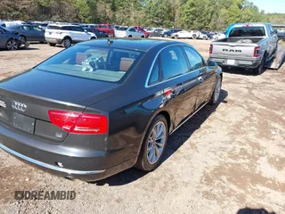 2011 Audi A8 with VIN WAURVAFDXBN014290, listed as a IAAI auction lot 40860777 with 152,584 mi miles and . Bid and sale history available at DreamBid. Image 4.