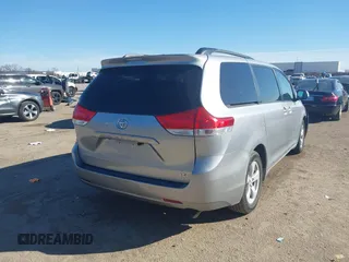2011 Toyota Sienna LE AAS with VIN 5TDKK3DCXBS143921, listed as a IAAI auction lot 41689053 with 199,854 mi miles. Bid and sale history available at carsss.com. Image 4.