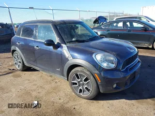 2011 MINI Countryman S with VIN WMWZC5C54BWL55124, listed as a IAAI auction lot 41666874 with 197,656 mi miles and . Bid and sale history available at DreamBid. Image 1.