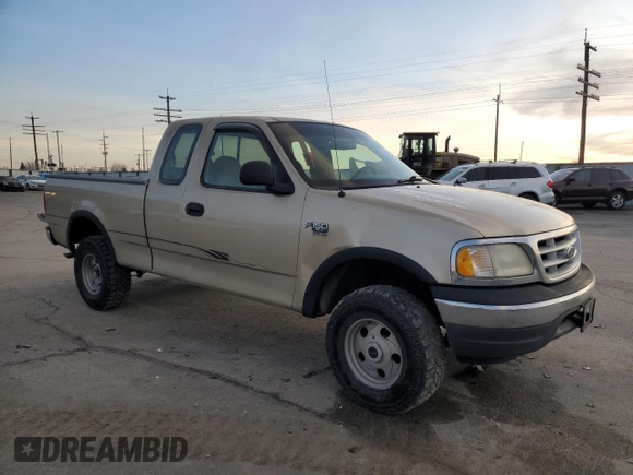 1999 Ford F-150 z VIN 2FTRX18W3XCA06671, wystawiony jako Copart lot #85561784 z przebiegiem 100 579 mil mil oraz Szkoda całkowita • Salvage title. Historia ofert i sprzedaży dostępna na DreamBid. Obrazek 4.