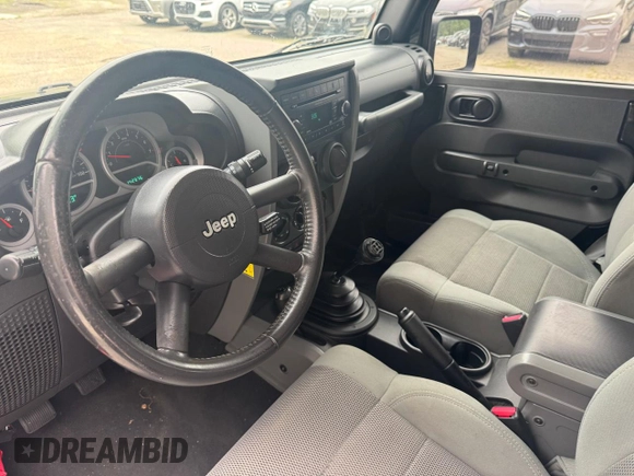 2007 Jeep Wrangler Rubicon с VIN 1J4GA64127L170574, выставлен на аукционе Copart как лот 60906965 с пробегом 142 976 миль миль и Чистый • Clean title. История ставок и продаж доступна на DreamBid. Изображение 9.