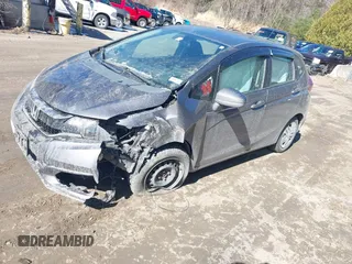 2018 Honda Fit LX z VIN 3HGGK5G44JM716592, wystawiony jako IAAI lot #41878820 z przebiegiem 70 464 mil mil oraz . Historia ofert i sprzedaży dostępna na DreamBid. Obrazek 2.