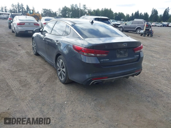 2016 Kia Optima SX Turbo z VIN 5XXGW4L28GG010897, wystawiony jako IAAI lot #42703779 z przebiegiem 121 918 mil mil oraz . Historia ofert i sprzedaży dostępna na DreamBid. Obrazek 3.