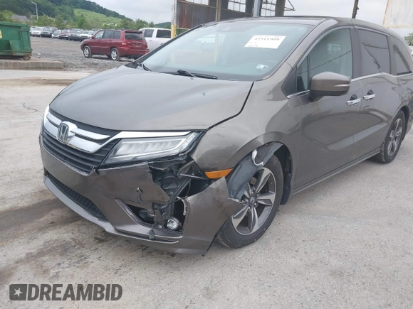 2018 Honda Odyssey Touring with VIN 5FNRL6H89JB057148, listed as a IAAI auction lot 42511909 with 166,438 mi miles and . Bid and sale history available at DreamBid. Image 6.