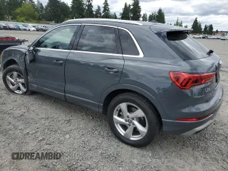 2020 Audi Q3 Premium with VIN WA1AECF31L1002342, listed as a Copart auction lot 60729665 with 29,154 mi miles and Salvage title. Bid and sale history available at DreamBid. Image 2.