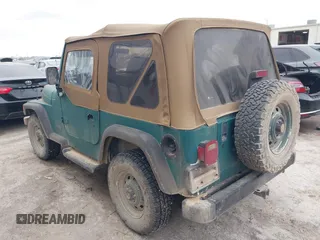 1997 Jeep Wrangler SE with VIN 1J4FY29P1VP408966, listed as a IAAI auction lot 41683640 with 106,910 mi miles. Bid and sale history available at carsss.com. Image 3.