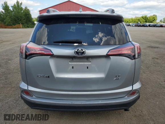 2018 Toyota RAV4 LE with VIN 2T3BFREV8JW788362, listed as a Copart auction lot 64053735 with 124,668 mi miles and Salvage title. Bid and sale history available at DreamBid. Image 6.