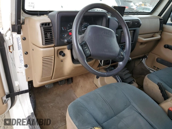 2000 Jeep Wrangler Sahara with VIN 1J4FA59SXYP760278, listed as a Copart auction lot 60402485 with 192,161 mi miles and Salvage title. Bid and sale history available at DreamBid. Image 8.
