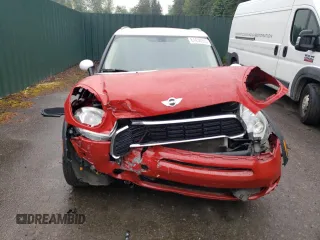 2014 MINI Countryman S with VIN WMWZC3C52EWP25379, listed as a Copart auction lot 61438355 with 76,943 mi miles and Salvage title. Bid and sale history available at DreamBid. Image 5.