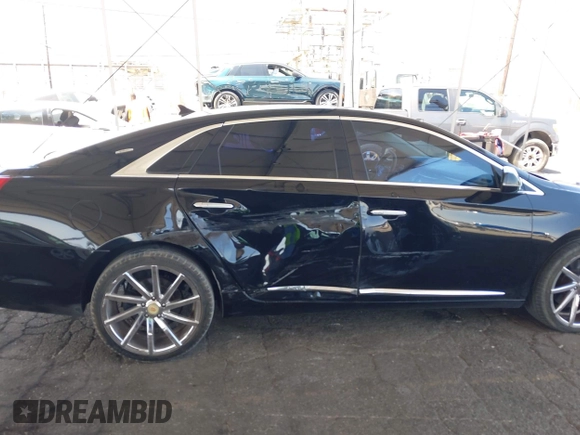 2013 Cadillac XTS Luxury with VIN 2G61P5S35D9105460, listed as a IAAI auction lot 42582313 with 144,895 mi miles and . Bid and sale history available at DreamBid. Image 6.