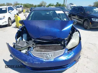 2009 Honda Fit with VIN JHMGE88249S056575, listed as a IAAI auction lot 41702555 with 116,658 mi miles. Bid and sale history available at carsss.com. Image 12.
