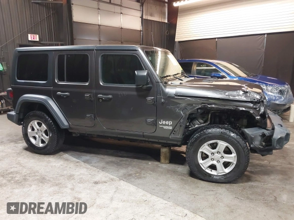 2018 Jeep Wrangler Unlimited Sport S with VIN 1C4HJXDG5JW126496, listed as a IAAI auction lot 42390584 with 163,476 mi miles and . Bid and sale history available at DreamBid. Image 14.