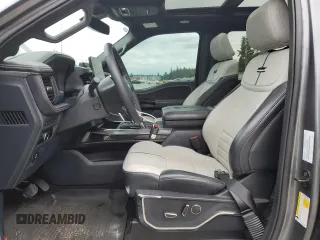 2023 Ford F-150 Lightning Pro with VIN 1FT6W1EV9PWG25278, listed as a Copart auction lot 60293095 with 24,450 mi miles and Salvage title. Bid and sale history available at DreamBid. Image 7.