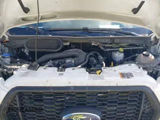 2023 Ford Transit Cargo with VIN 1FTBR1C87PKA63830, listed as a IAAI auction lot 40797669 with 69,162 mi miles and . Bid and sale history available at DreamBid. Image 10.