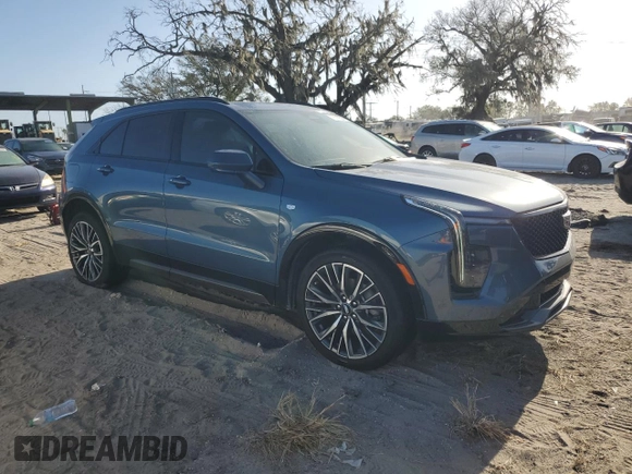 2024 Cadillac XT4 FWD Sport with VIN 1GYFZER40RF249101, listed as a Copart auction lot 76312304 with 1,969 mi miles and Salvage title. Bid and sale history available at DreamBid. Image 4.