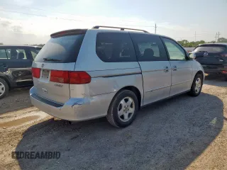 2001 Honda Odyssey EX z VIN 2HKRL18641H619203, wystawiony jako Copart lot #59329555 z przebiegiem 180 058 mil mil oraz Czysty tytuł • Clean title. Historia ofert i sprzedaży dostępna na DreamBid. Obrazek 3.