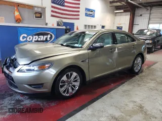 2012 Ford Taurus Limited with VIN 1FAHP2JW3CG142762, listed as a Copart auction lot 77864584 with 131,911 mi miles and Salvage title. Bid and sale history available at DreamBid. Image 1.