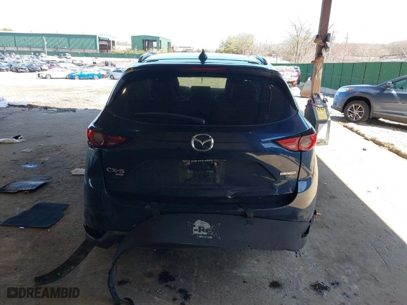 2021 Mazda CX-5 Grand Touring Reserve with VIN JM3KFBAY7M0466156, listed as a IAAI auction lot 41931407 with 55,136 mi miles. Bid and sale history available at carsss.com. Image 16.