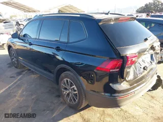 2021 Volkswagen Tiguan S with VIN 3VV1B7AX2MM051166, listed as a IAAI auction lot 41233878 with 28,690 mi miles. Bid and sale history available at carsss.com. Image 3.