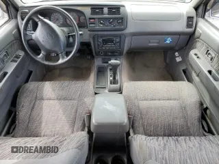 2000 Nissan Frontier XE with VIN 1N6ED27T8YC367452, listed as a Copart auction lot 55866345 with 242,945 mi miles and Salvage title. Bid and sale history available at DreamBid. Image 8.