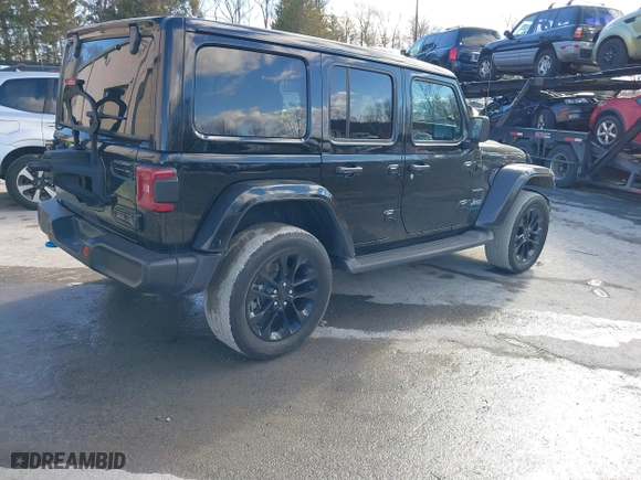 2023 Jeep Wrangler 4xe Sahara with VIN 1C4JJXP62PW613040, listed as a IAAI auction lot 41489171 with 36,818 mi miles. Bid and sale history available at carsss.com. Image 4.