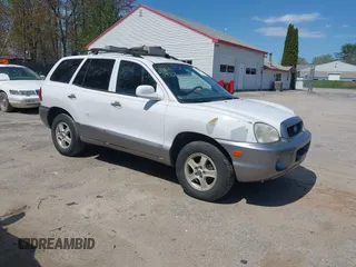 2002 Hyundai Santa Fe GLS z VIN KM8SC13D22U270603, wystawiony jako IAAI lot #42213488 z przebiegiem 119 697 mil mil oraz . Historia ofert i sprzedaży dostępna na DreamBid. Obrazek 1.