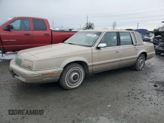1992 Chrysler New Yorker z VIN 1C3XV66R9ND794543, wystawiony jako Copart lot #45347925 z przebiegiem 46 550 mil mil oraz Tytuł czysty. Historia ofert i sprzedaży dostępna na DreamBid. Obrazek 1.