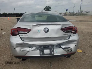 2018 Buick Regal Essence с VIN W04GP6SX8J1086932, выставлен на аукционе Copart как лот 54824185 с пробегом 69 473 миль миль и Списание • Salvage title. История ставок и продаж доступна на DreamBid. Изображение 6.