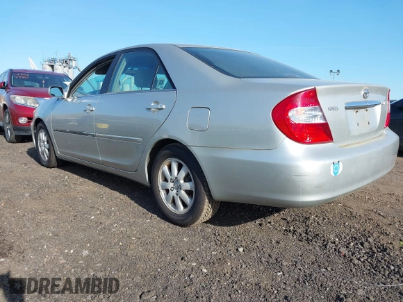 2003 Toyota Camry LE with VIN 4T1BE30K43U227357, listed as a IAAI auction lot 42144237 with 101,135 mi miles and . Bid and sale history available at DreamBid. Image 3.