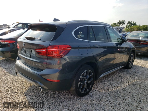 2021 BMW X1 xDrive28i with VIN WBXJG9C09M5T96327, listed as a Copart auction lot 49876493 with 42,572 mi miles and . Bid and sale history available at DreamBid. Image 3.