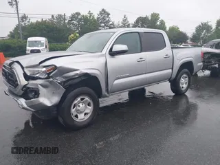 2023 Toyota Tacoma SR with VIN 3TYAX5GN0PT071080, listed as a IAAI auction lot 42426897 with 58,017 mi miles and . Bid and sale history available at DreamBid. Image 2.