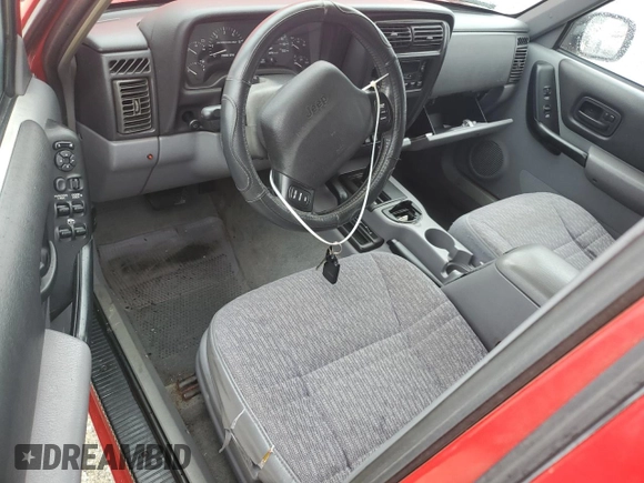 1998 Jeep Cherokee Sport with VIN 1J4FJ68S7WL275947, listed as a Copart auction lot 74333874 with 0 mi miles and Salvage Title. Bid and sale history available at carsss.com. Image 8.