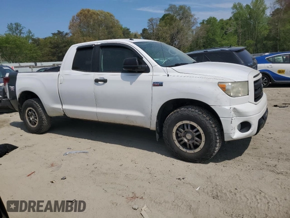 2010 Toyota Tundra 4WD Truck with VIN 5TFUY5F1XAX123787, listed as a Copart auction lot 54447555 with 242,821 mi miles and Clean Title. Bid and sale history available at carsss.com. Image 4.