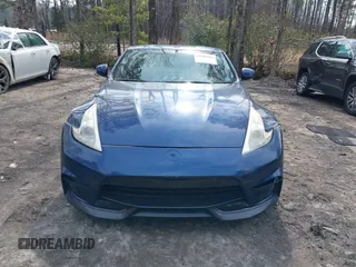 2014 Nissan 370Z Nismo z VIN JN1AZ4EH0EM631950, wystawiony jako IAAI lot #41685567 z przebiegiem 103 282 mil mil oraz . Historia ofert i sprzedaży dostępna na DreamBid. Obrazek 12.