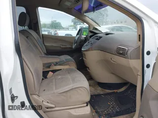 2007 Nissan Quest SL with VIN 5N1BV28U87N106556, listed as a IAAI auction lot 42121368 with 203,693 mi miles. Bid and sale history available at carsss.com. Image 5.