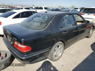 2001 Mercedes-Benz E-Class AWD with VIN WDBJF83J31X058259, listed as a Copart auction lot 74370604 with 131,454 mi miles and Clean Title. Bid and sale history available at carsss.com. Image 3.
