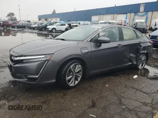 2018 Honda Clarity Plug-In Hybrid with VIN JHMZC5F17JC022801, listed as a Copart auction lot 84013154 with 106,590 mi miles and Clean Title. Bid and sale history available at carsss.com. Image 1.