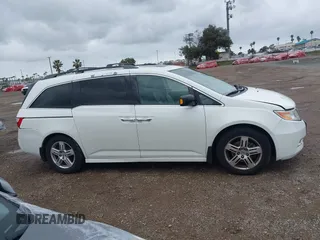 2013 Honda Odyssey Touring with VIN 5FNRL5H99DB041328, listed as a IAAI auction lot 41797520 with 148,523 mi miles and . Bid and sale history available at carsss.com. Image 13.