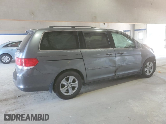 2010 Honda Odyssey Touring with VIN 5FNRL3H91AB113770, listed as a Copart auction lot 61893115 with 155,776 mi miles and Salvage title. Bid and sale history available at DreamBid. Image 3.