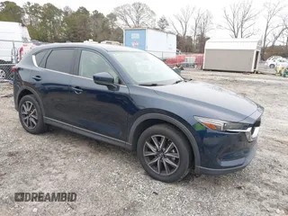2017 Mazda CX-5 Grand Touring with VIN JM3KFBDL9H0180038, listed as a IAAI auction lot 41394047 with 111,581 mi miles. Bid and sale history available at carsss.com. Image 1.